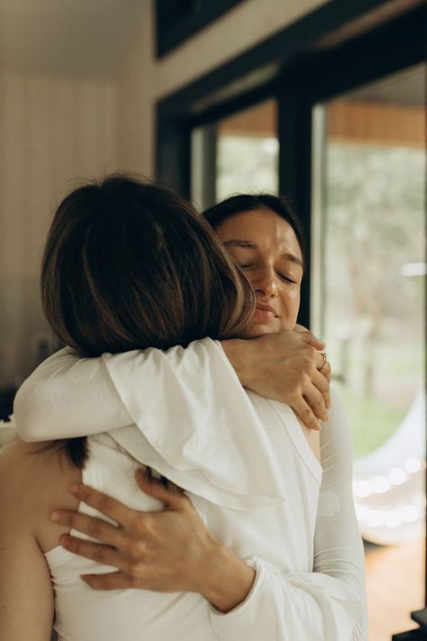 Two women embracing, symbolizing support and connection